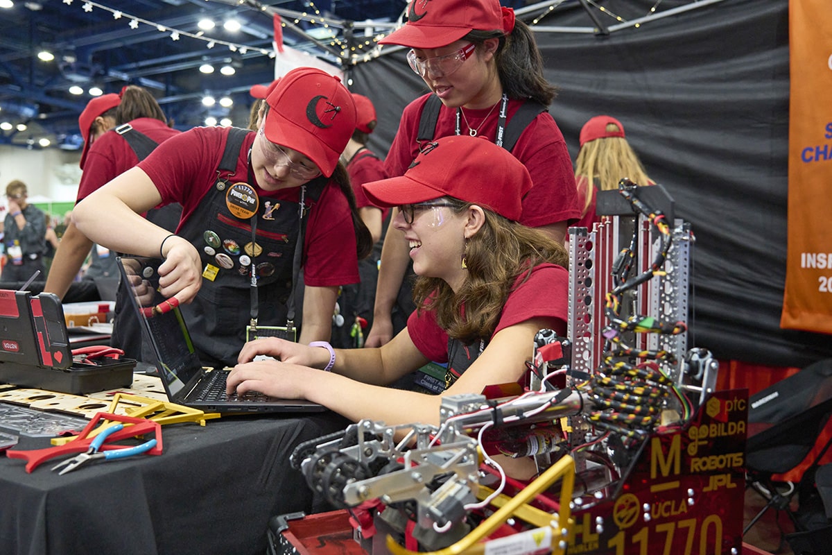 Young students working on their robot for the FIRST Championship in Houston in 2021.
